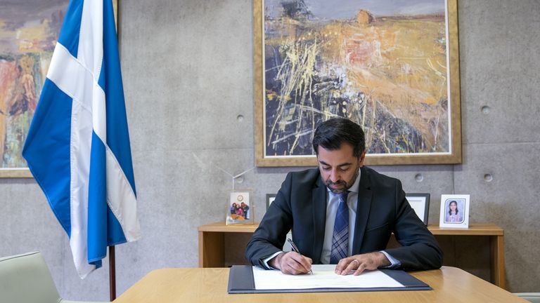 Outgoing First Minister Humza Yousaf signs his official resignation letter to King Charles III at the Scottish Parliament in Edinburgh. Picture date: Tuesday May 7, 2024.