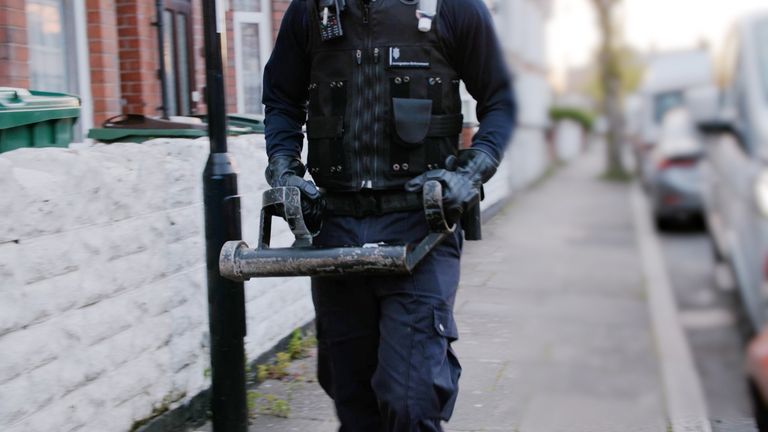 Immigration officers carrying out a detention visit.
Pic: Home Office/PA