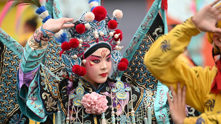     A woman dances in a traditional costume at the opening ceremony.  DPA/AP Photo