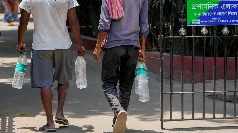 People stock up on water in India. Pic: AP