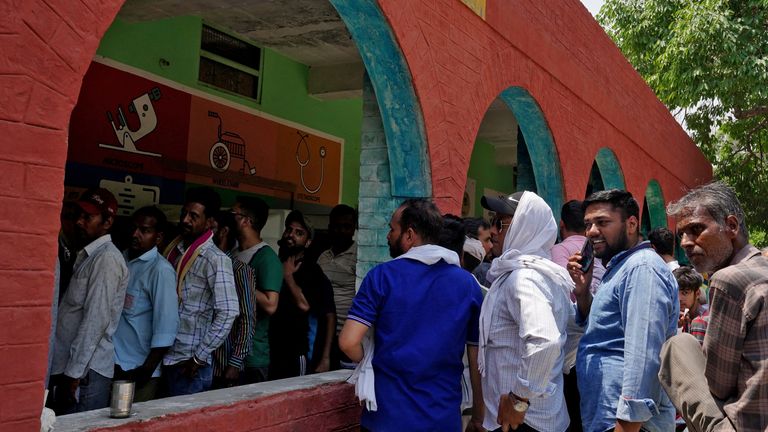 People queue to vote in the sixth round of elections in the northern state of Haryana on 25 May. Pic: Reuters