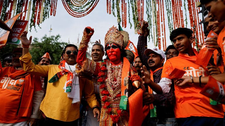 A Modi support dressed as the Hindu God &#39;Hanuman&#39; cheers at one of his rallies. Pic: Reuters