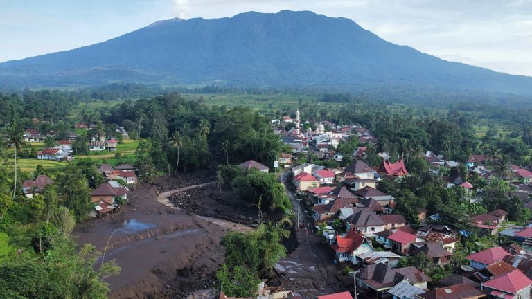 This drone photo shows the damage at a village affected by a flash flood in Tanah Datar, West Sumatra, Indonesia, Monday, May 13, 2024. Heavy rains and torrents of cold lava and mud flowing down a volcano&#39;s slopes on Indonesia&#39;s Sumatra island triggered flash floods causing a number of people dead and missing, officials said Sunday. (AP Photo/Ali Nayaka)