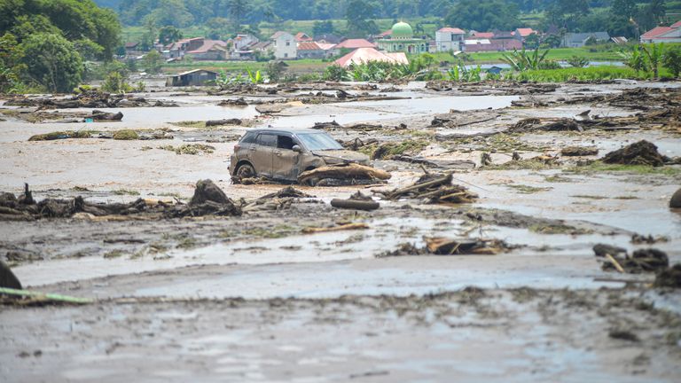 MANDATORY CREDIT.
A damaged car is seen in an area affected by heavy rain brought flash floods and landslides in Agam, West Sumatra province, Indonesia, May 12, 2024, in this photo taken by Antara Foto. Antara Foto/Iggo El Fitra/via REUTERS ATTENTION EDITORS - THIS IMAGE HAS BEEN SUPPLIED BY A THIRD PARTY. MANDATORY CREDIT. INDONESIA OUT. NO COMMERCIAL OR EDITORIAL SALES IN INDONESIA.