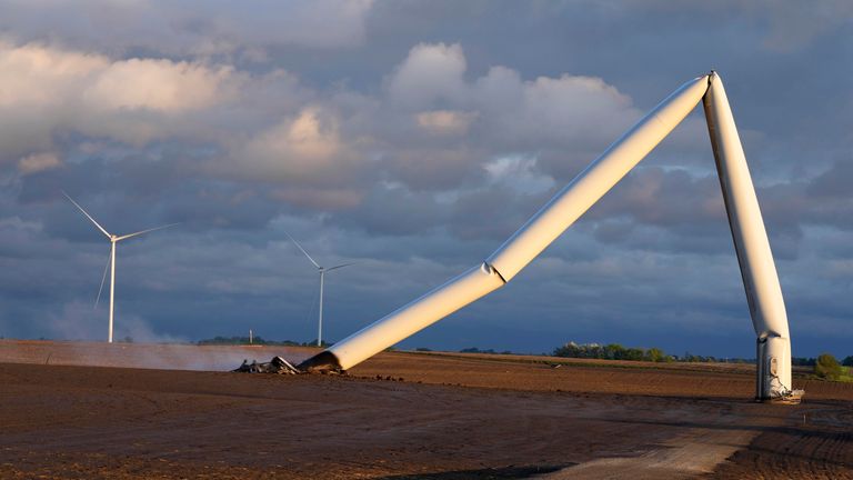 Photo: AP The remains of a wind turbine damaged by a tornado touch the ground in a field, Tuesday, May 21, 2024, near Prescott, Iowa.  (AP Photo/Charlie Neibergall)