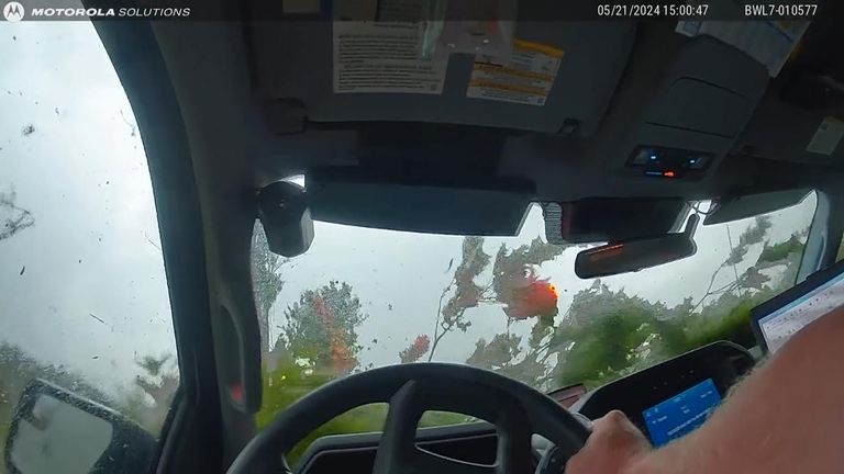 Iowa officer caught in path of tornado.