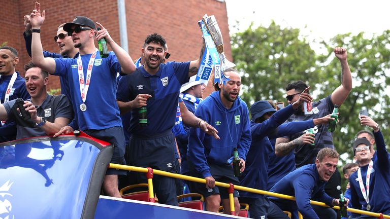 Ipswich Towns' Massimo Luongo lifts the Sky Bet Championship trophy during an open top bus parade in Ipswich.  Photo: PA