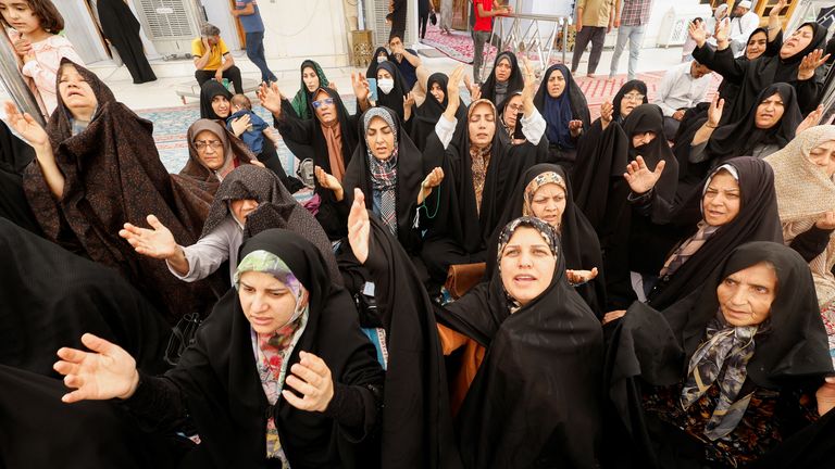 Iranian Shiite pilgrims pray in Najaf, Iraq, after the death of Mr Raisi. Pic: Reuters