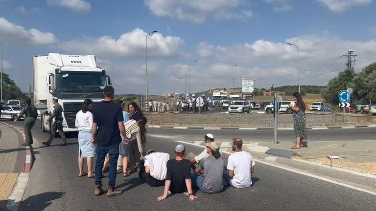 Israeli protesters block a convoy of aid headed for Gaza