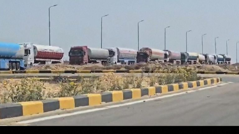 Aid trucks enter Gaza via the Kerem Shalom crossing in southern Israel on Sunday. Pic: AP