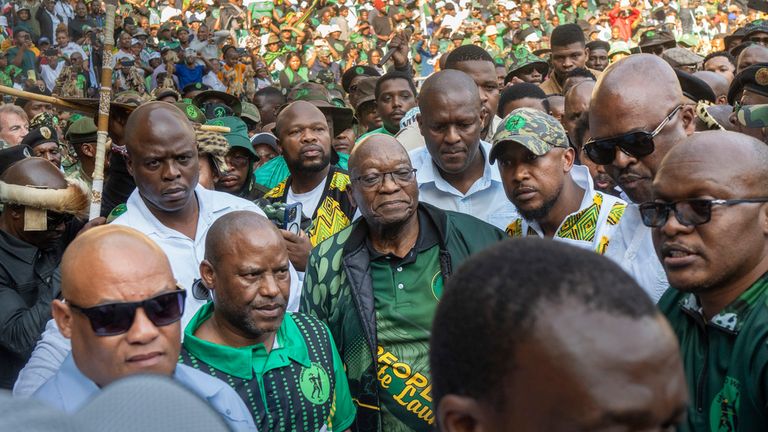 Former South African President Jacob Zuma, centre, arrives at a stadium in Soweto for the launch of his party's manifesto. Pic: AP