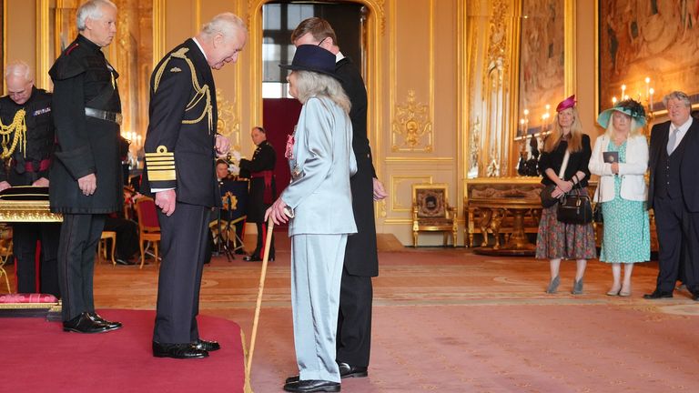 Pic: Jonathan Brady/PA
Dame Jilly Cooper, from Stroud, Author, is made a Dame Commander of the British Empire by King Charles III at Windsor Castle. The honour recognises services to literature and to charity.    Picture date: Tuesday May 14, 2024. PA Photo. See PA story ROYAL Investiture. Photo credit should read: Jonathan Brady/PA Wire 
