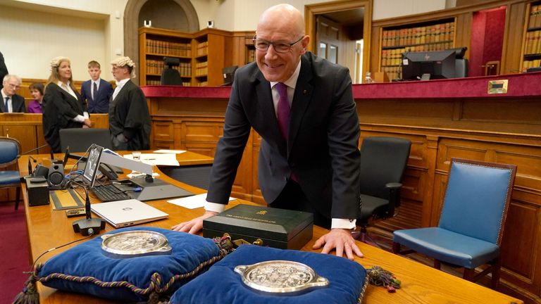 John Swinney stands with the Seals of Scotland as he is sworn in as First Minister of Scotland and Keeper of the Scottish Seal, at the Court of Session in Edinburgh. Picture date: Wednesday May 8, 2024.