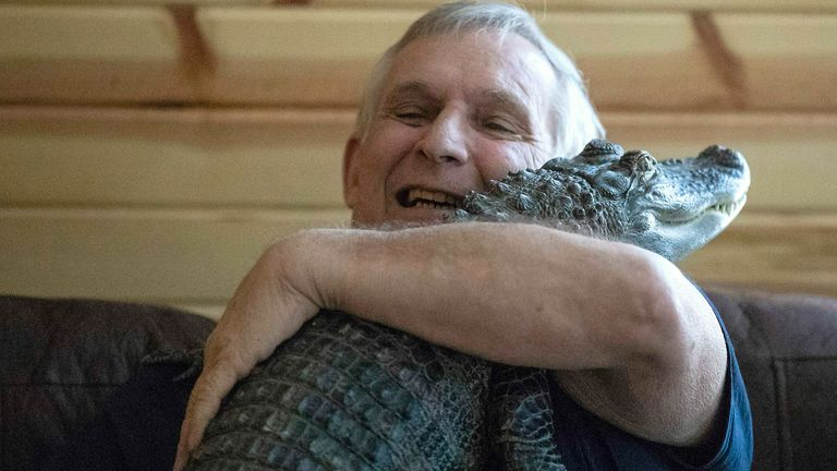 Joie Henney with his beloved reptile in happier times. Pic: Heather Khalifa/The Philadelphia Inquirer via AP