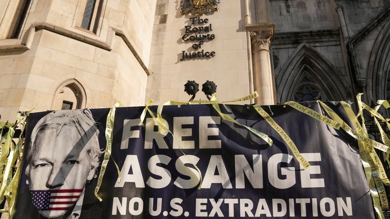 A banner is attached to a fence outside the High Court on the day of an extradition hearing of WikiLeaks founder Julian Assange, in London, Britain, May 20, 2024. REUTERS/Maja Smiejkowska
