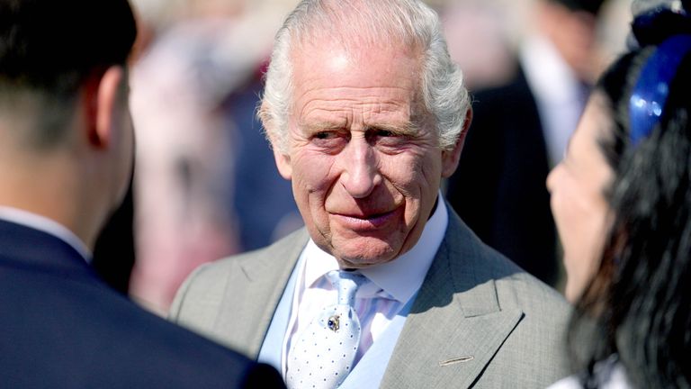 King Charles speaks to guests attending a Royal Garden Party at Buckingham Palace. Pic: PA