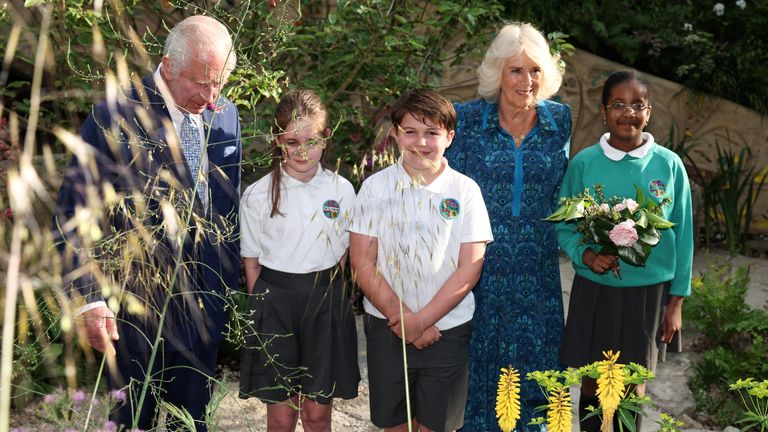 King Charles III (left) and Queen Camilla (second right) meet with pupils of the Sulivan Primary school as they visit the No Adults Allowed Garden, that they children co-designed, during a visit to the RHS Chelsea Flower Show at the Royal Hospital Chelsea in London. Picture date: Monday May 20, 2024.