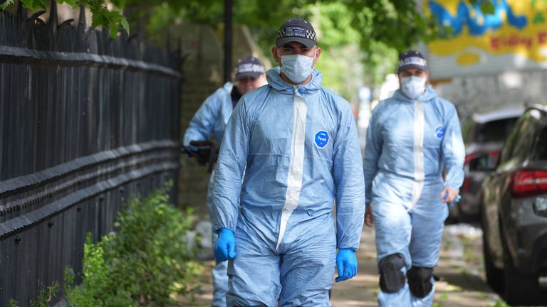 Police forensic officers on Kingsland High Street.
Pic PA