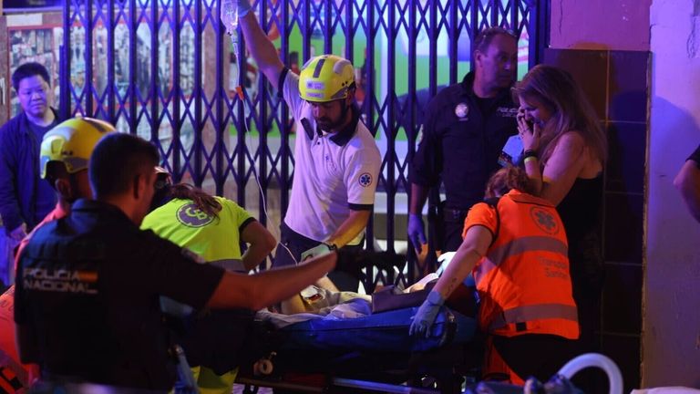 Several emergency services evacuate the injured on the beach of Palma, May 24, 2024, in Palma de Mallorca, Mallorca, Balearic Islands (Spain). At least two people have died Thursday in the collapse of a building in Playa de Palma, as reported by 112 on the social network X where it also indicates that there would be between 12 and 14 injured of varying degrees. 23 MAY 2024 Isaac Buj / Europa Press 05/23/2024 (Europa Press via AP)
