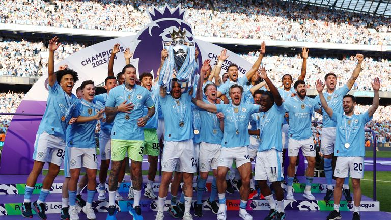 Soccer Football - Premier League - Manchester City v West Ham United - Etihad Stadium, Manchester, Britain - May 19, 2024 Manchester City&#39;s Kyle Walker and teammates celebrate with the trophy after winning the Premier League REUTERS/Molly Darlington EDITORIAL USE ONLY. NO USE WITH UNAUTHORIZED AUDIO, VIDEO, DATA, FIXTURE LISTS, CLUB/LEAGUE LOGOS OR &#39;LIVE&#39; SERVICES. ONLINE IN-MATCH USE LIMITED TO 120 IMAGES, NO VIDEO EMULATION. NO USE IN BETTING, GAMES OR SINGLE CLUB/LEAGUE/PLAYER PUBLICATIONS. P