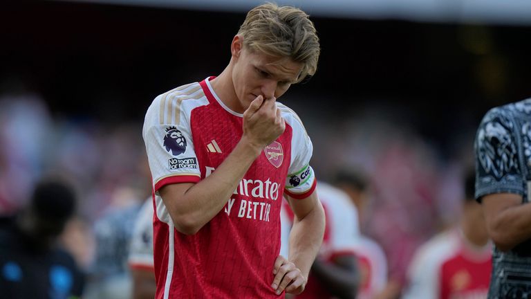 Arsenal&#39;s Martin Odegaard looks upset after his side&#39;s win was not enough to secure the Premier League title. Pic: AP