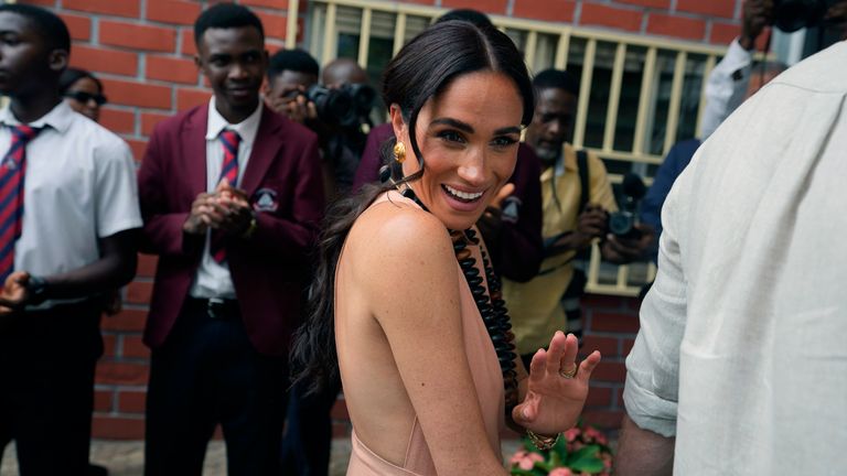 Pic: AP
Meghan Markle gestures as she and Prince Harry visit children at the Lights Academy in Abuja, Nigeria, Friday, May 10, 2024.  Prince Harry and his wife Meghan have arrived in Nigeria to champion the Invictus Games, which he founded to aid the rehabilitation of wounded and sick servicemembers and veterans. (AP Photo/Sunday Alamba)