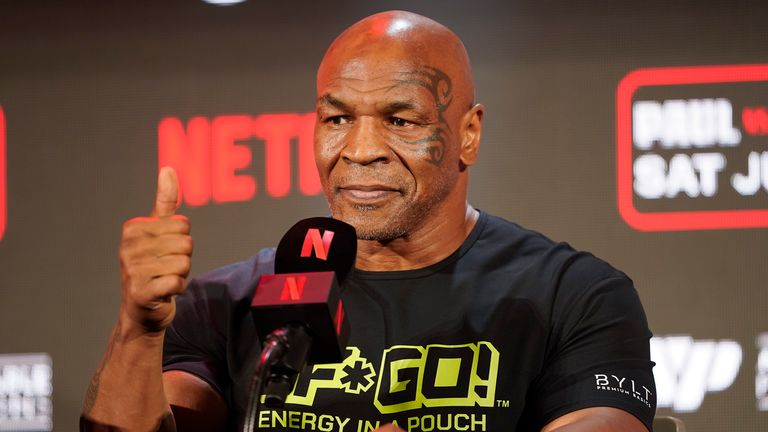 Mike Tyson gestures to the crowd during a news conference promoting his upcoming boxing bout against Jake Paul, Thursday, May 16, 2024, in Arlington, Texas. Pic: AP Photo/Sam Hodde
