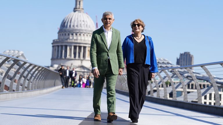 Sadiq Khan and his wife Saadiya Khan pose for photographers on the Millennium Bridge.
Pic PA