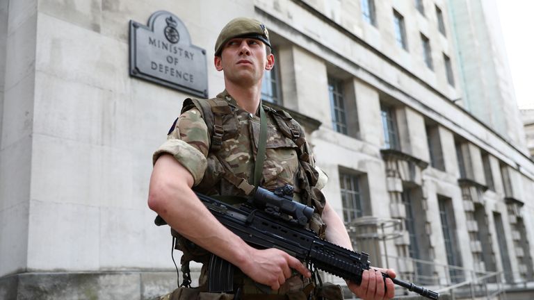 A soldier stands guard outside the MoD. Pic: Reuters