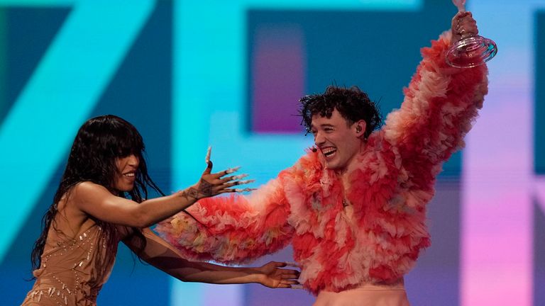 Nemo of Switzerland, who performed the song The Code, celebrates with last year&#39;s winner Loreen of Sweden after winning the Grand Final of the Eurovision Song Contest in Malmo, Sweden, Sunday, May 12, 2024. (AP Photo/Martin Meissner)