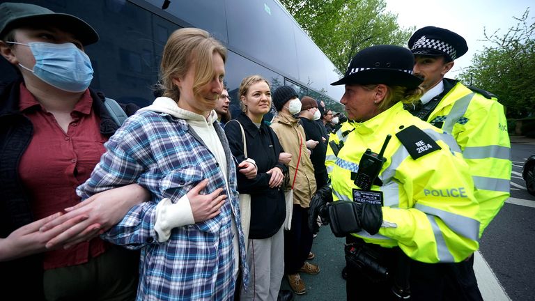 Police speaking to protesters who have formed a blockade around a coach which is parked near the Best Western hotel in Peckham.
Pic:PA