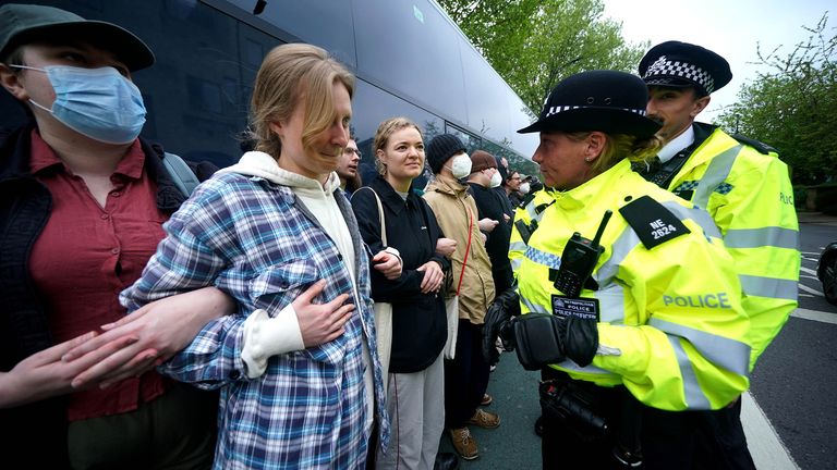 Police speaking to protesters who have formed a blockade around a coach which is parked near the Best Western hotel in Peckham.
Pic:PA