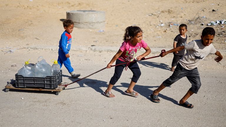 Pic: Reuters
Palestinian children pull water containers as people flee Rafah after Israeli forces launched a ground and air operation in the eastern part of the southern Gaza city, amid the ongoing conflict between Israel and Hamas, in the southern Gaza Strip May 9, 2024. REUTERS/Mohammed Salem TPX IMAGES OF THE DAY