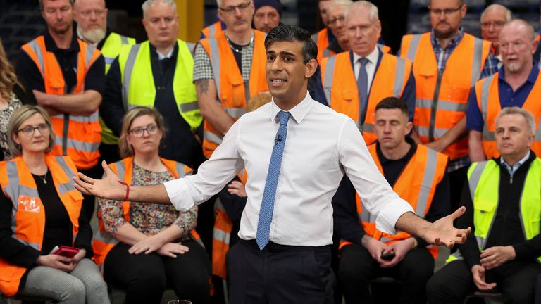 Rishi Sunak speaks with staff at a transport distribution centre in Ilkeston.
Pic Reuters