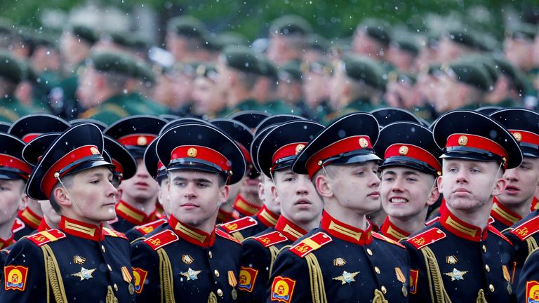 Russian service members and cadets during the march. Pic: Reuters