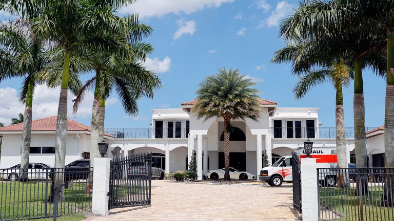 Sean Kingston's home in Southwest Ranches, Florida, is shown during a Broward Sheriff's Office raid on Thursday, May 23, 2024. A SWAT team raided rapper Kingston's rented mansion on Thursday.  and arrested his mother on fraud and theft charges that a lawyer says stemmed in part from installing a huge television in the house.  (Amy Beth Bennett/South Florida Sun-Sentinel via AP)