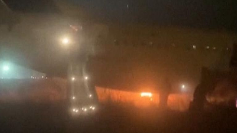 Plane skids off of runway and catches fire, injuring some passengers