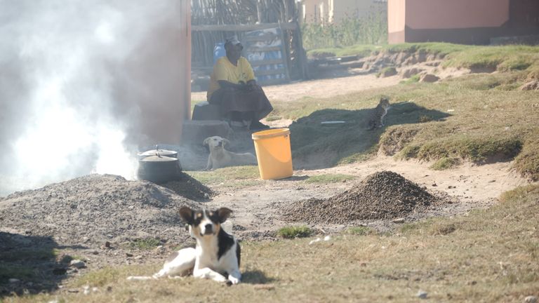 Older women cooking with dried cow dung