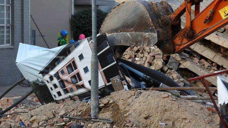 Pic: Reuters
Rescuers use an excavator at the site where construction workers are trapped under a building that collapsed in George, South Africa May 7, 2024. REUTERS/Esa Alexander