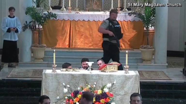 A police officer at the scene inside the church. Pic: St Mary Magdalen Church/NBC News