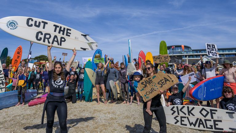 EDITORIAL USE ONLY NOTE LANGUAGE ON PLACARDS People take part in a protest by Surfers Against Sewage (SAS), in Falmouth, who are calling for an end to the sewage discharges plaguing the UK&#39;s rivers and seas. Picture date: Saturday May 18, 2024.


