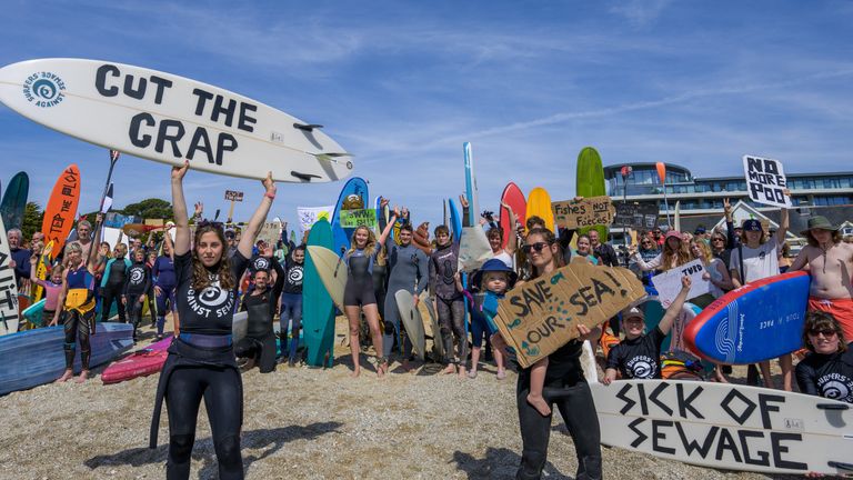 EDITORIAL USE ONLY NOTE LANGUAGE ON PLACARDS People take part in a protest by Surfers Against Sewage (SAS), in Falmouth, who are calling for an end to the sewage discharges plaguing the UK&#39;s rivers and seas. Picture date: Saturday May 18, 2024.

