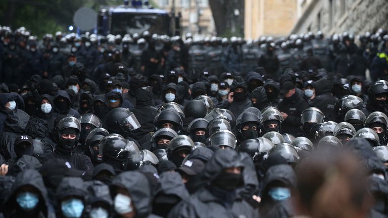 Pic: Reuters
Law enforcement officers stand guard near the parliament building as demonstrators hold a rally to protest against a bill on "foreign agents" in Tbilisi, Georgia, May 14, 2024. REUTERS/Irakli Gedenidze