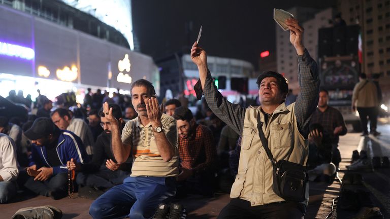 People prayed for the wellbeing of Mr Raisi on Sunday in Tehran. Pic: Reuters