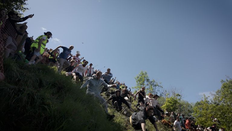 Tewkesbury's mucky, hazardous, undignified cheese rolling competition begins