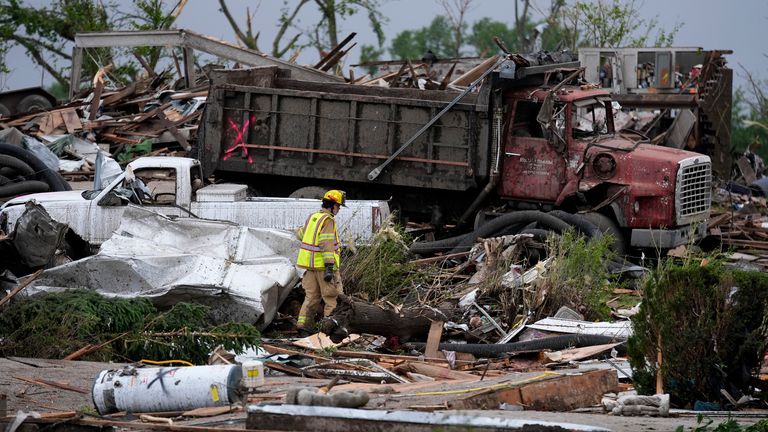 Pic: AP
A firefighter walks among homes destroyed by a tornado Tuesday, May 21, 2024, in Greenfield, Iowa. (AP Photo/Charlie Neibergall)