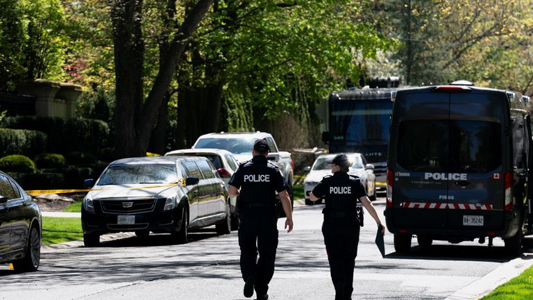Toronto Police investigators work outside of 21 Park Lane Circle after a security guard was shot outside the Bridle Path mansion of Canadian rap star Drake in Toronto, Ontario, Canada May 7, 2024. REUTERS/Arlyn McAdorey
