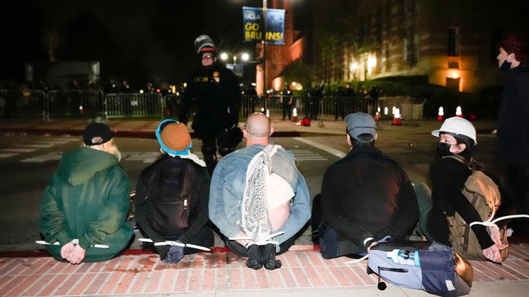 Protesters are detained on the UCLA campus.  Photo: AP
