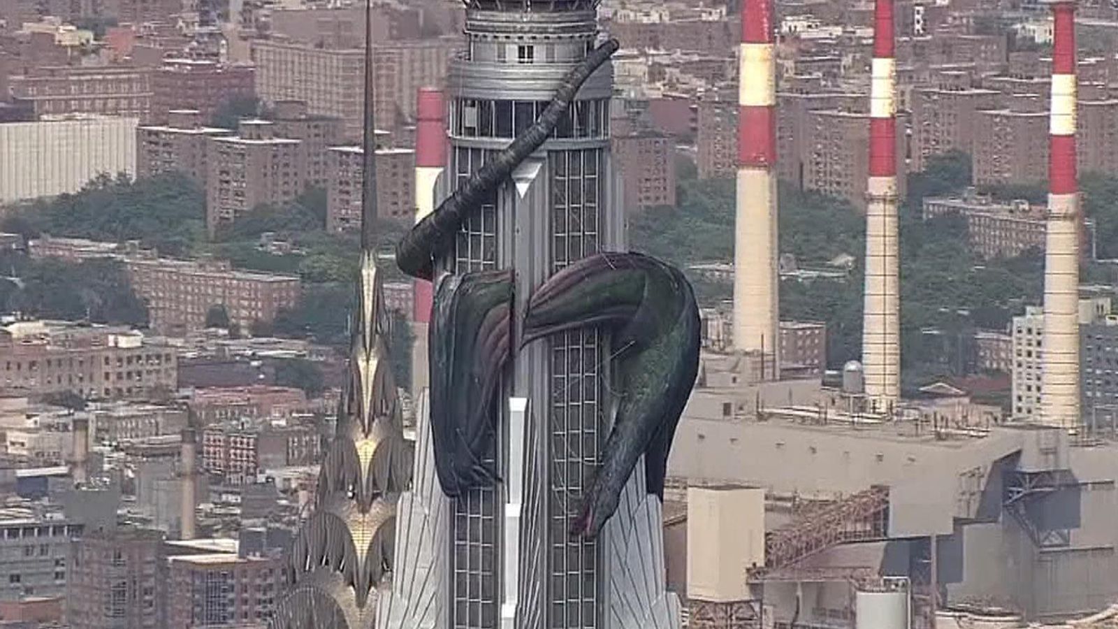 dragon around empire state building        
        <figure class=