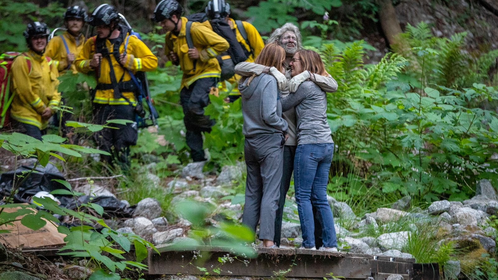 Heartwarming pictures of hiker reuniting with family after being lost